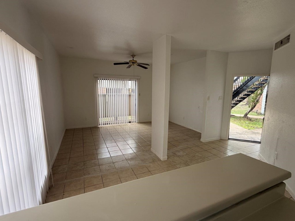 7901 Cambridge Street, Unit 25 Houston, TX 77054 - Photo 6 of 18 a view of an empty room and window