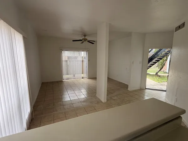 a view of an empty room and window