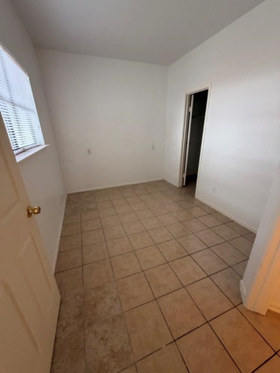 7901 Cambridge Street, Unit 25 Houston, TX 77054 - Photo 8 of 18 a view of a room with a white wall and a window