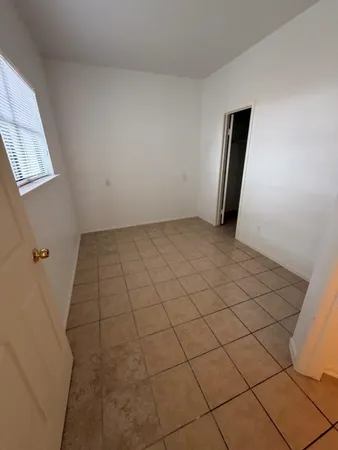 a view of a room with white walls