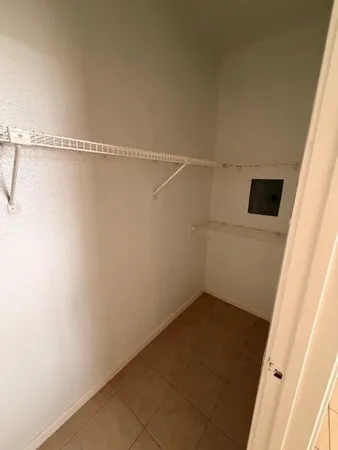 a view of a room with racks on the wall