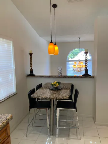 a view of a dining room and tables