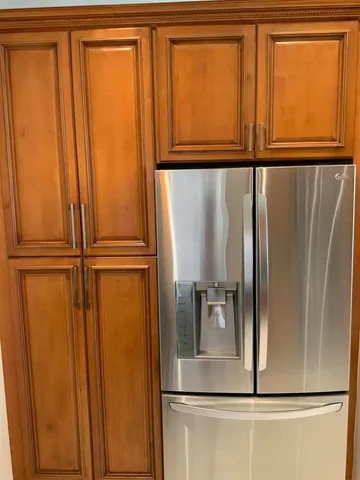 a view of a refrigerator in a kitchen