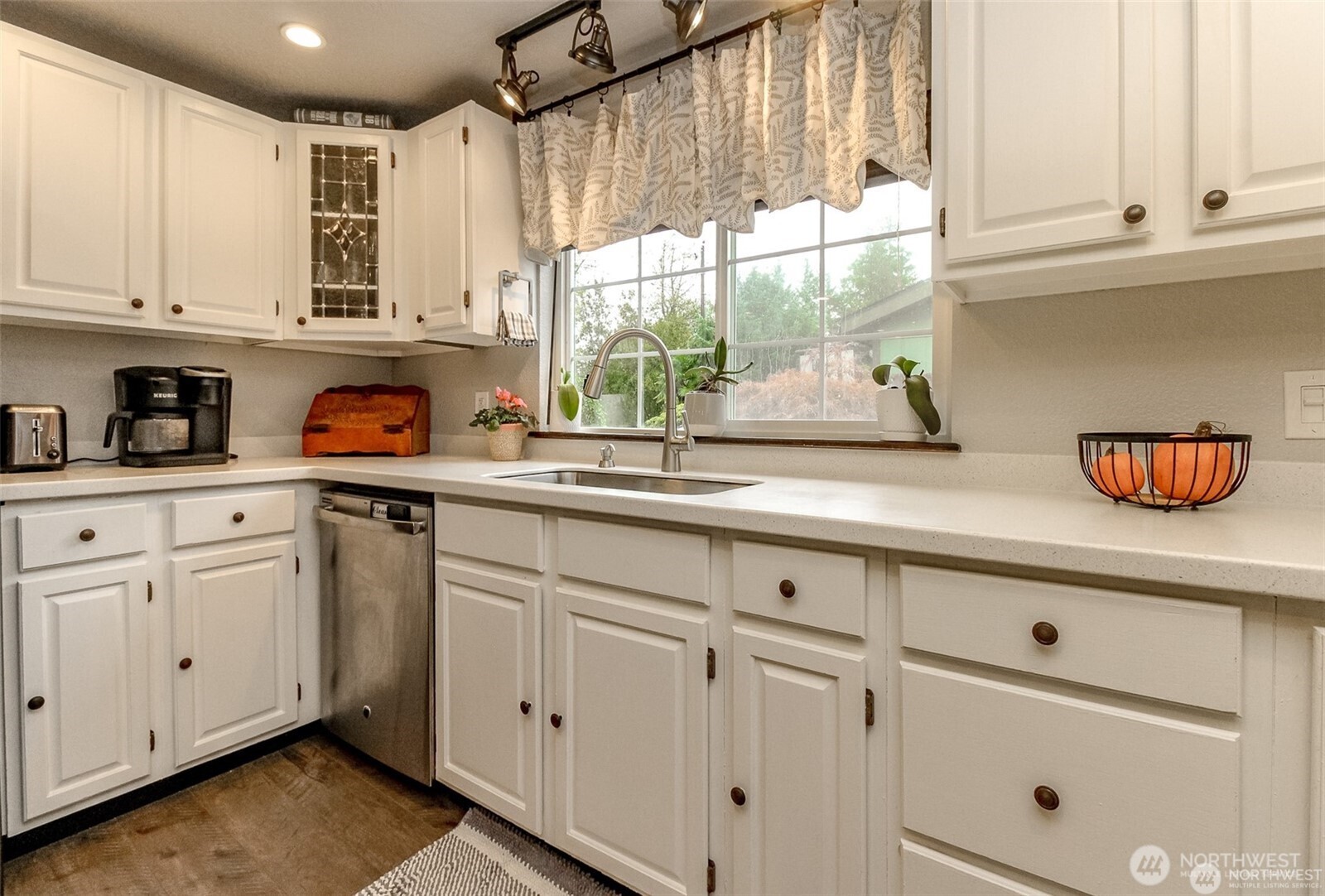 609 Hill Road Aberdeen, WA 98520 - Photo 11 of 38 a kitchen with stainless steel appliances granite countertop white cabinets and a window