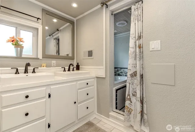 a kitchen with a sink and a stove top oven