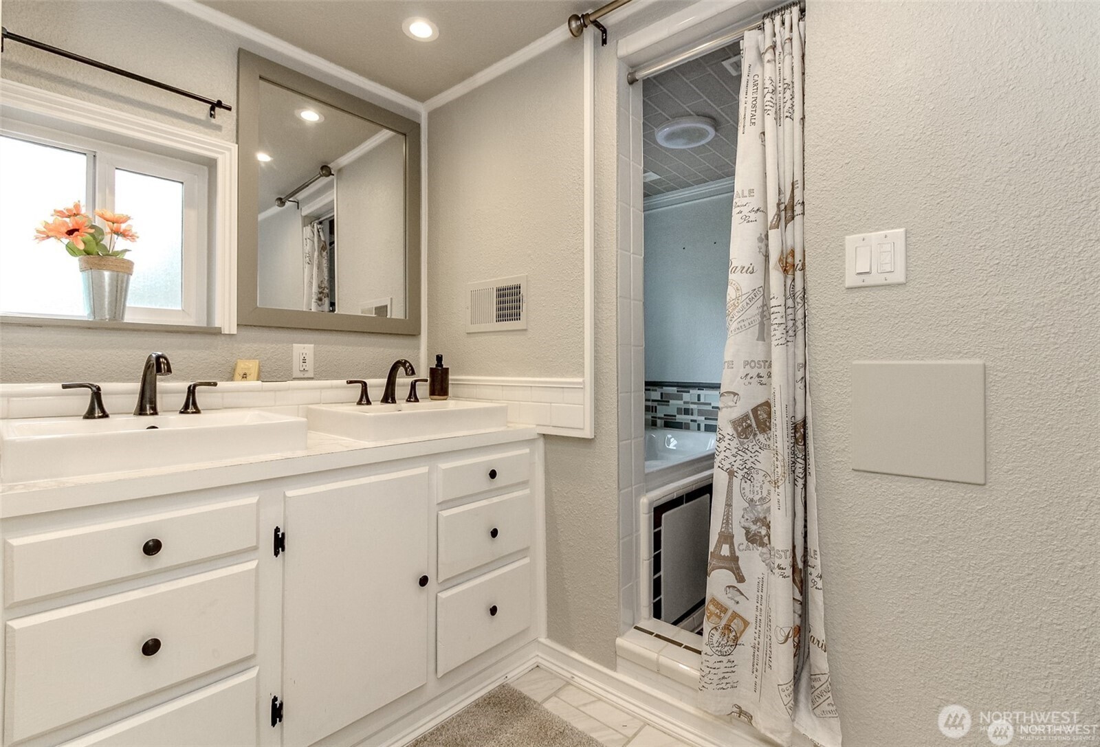 609 Hill Road Aberdeen, WA 98520 - Photo 15 of 38 a bathroom with a double vanity sink a mirror and a shower