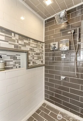 a view of kitchen with microwave and cabinets