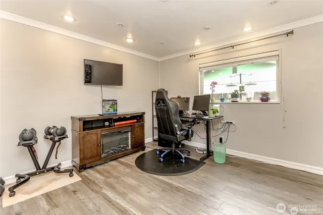 a view of a livingroom with furniture and a flat screen tv