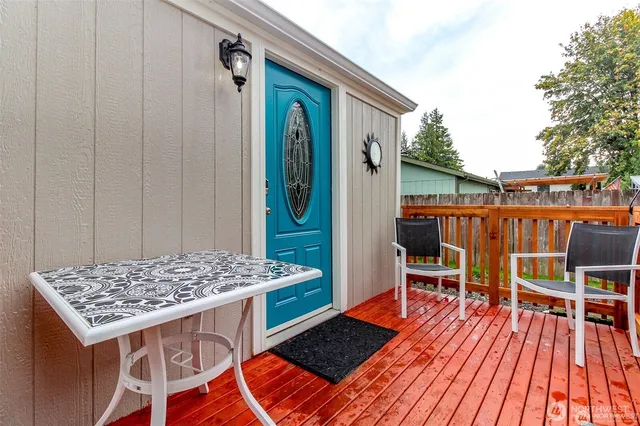 a small white house with a outdoor space