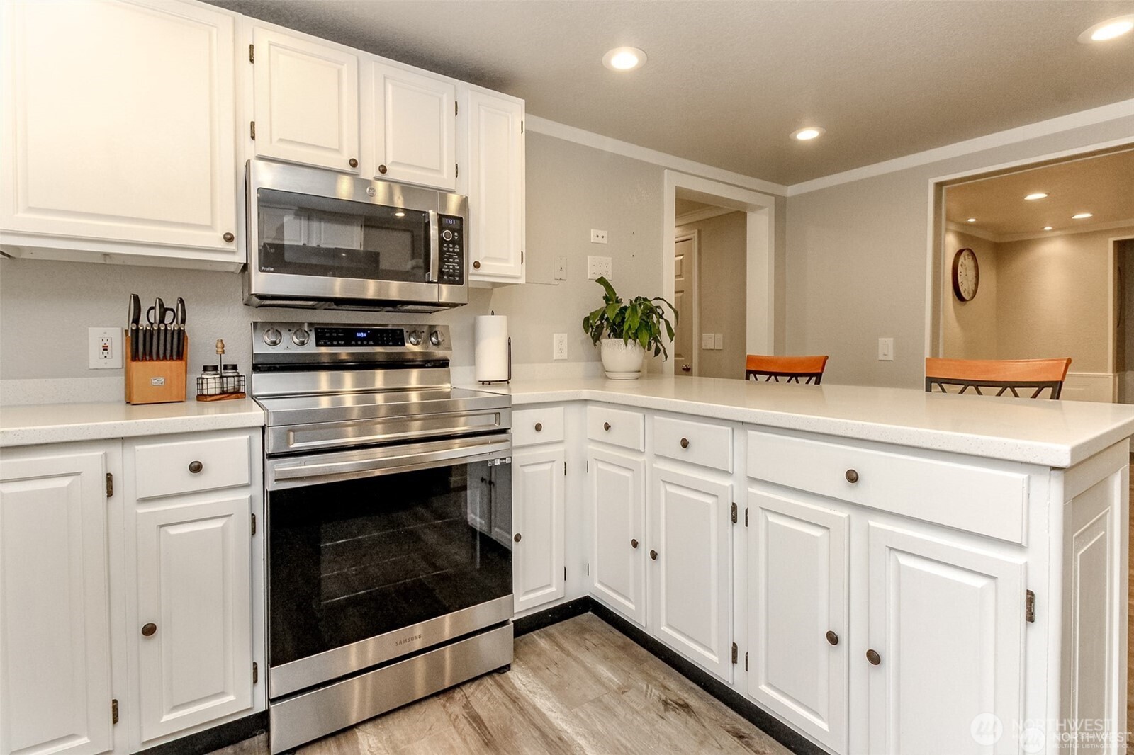 609 Hill Road Aberdeen, WA 98520 - Photo 10 of 38 a kitchen with stainless steel appliances white cabinets a sink and a stove