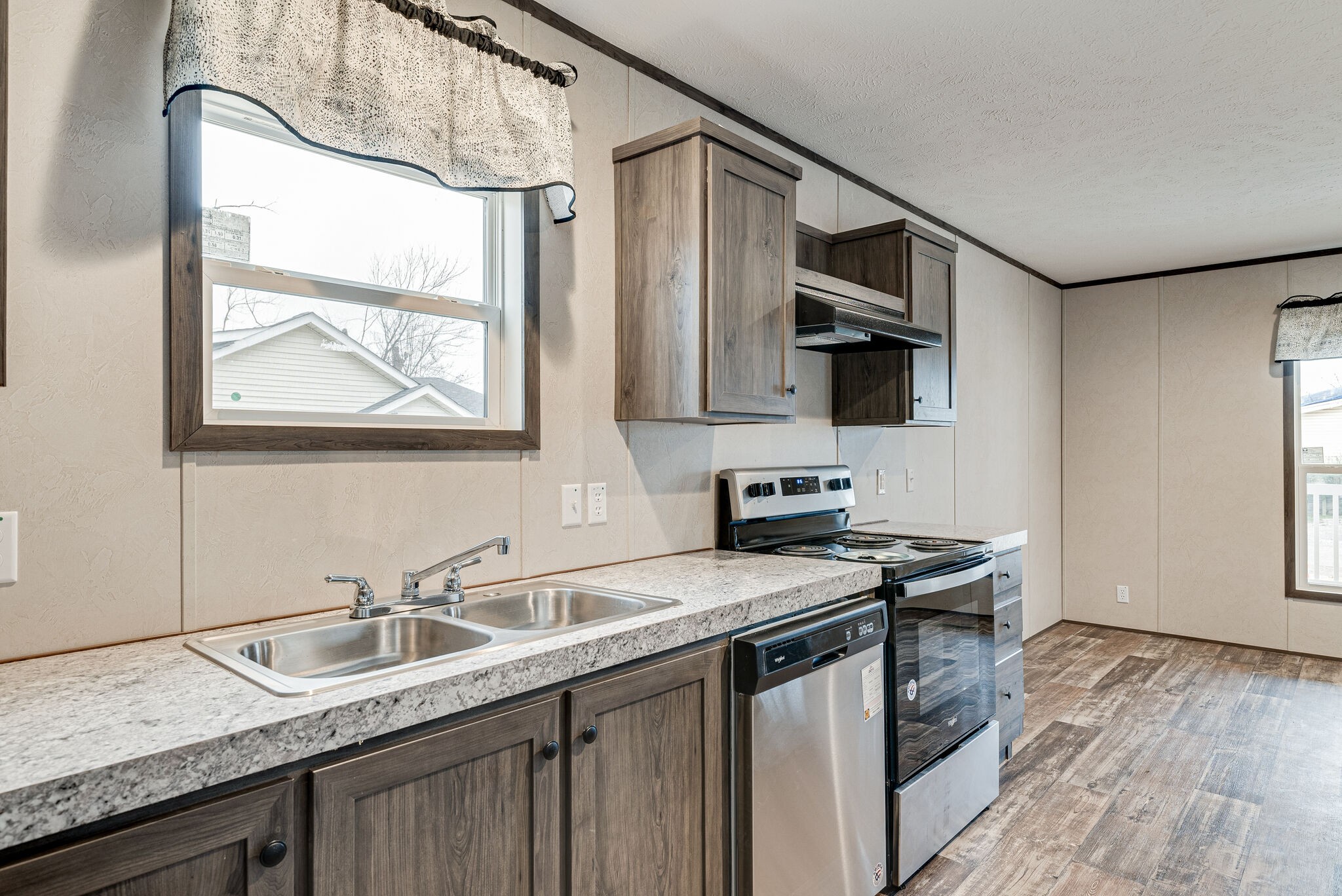 1321 Parham Street Springfield, TN 37172 - Photo 7 of 21 a kitchen with stainless steel appliances granite countertop a sink stove and microwave