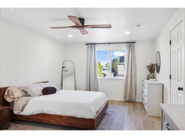 a bedroom with a bed and a dresser