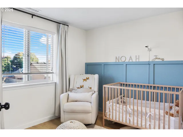 a view of a bedroom with furniture and windows