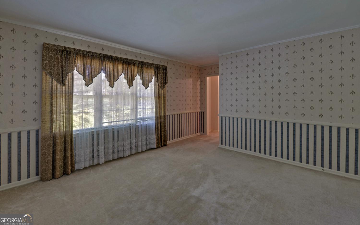 400 Harris Street Toccoa, GA 30577 - Photo 8 of 49 a view of an empty room with a large window