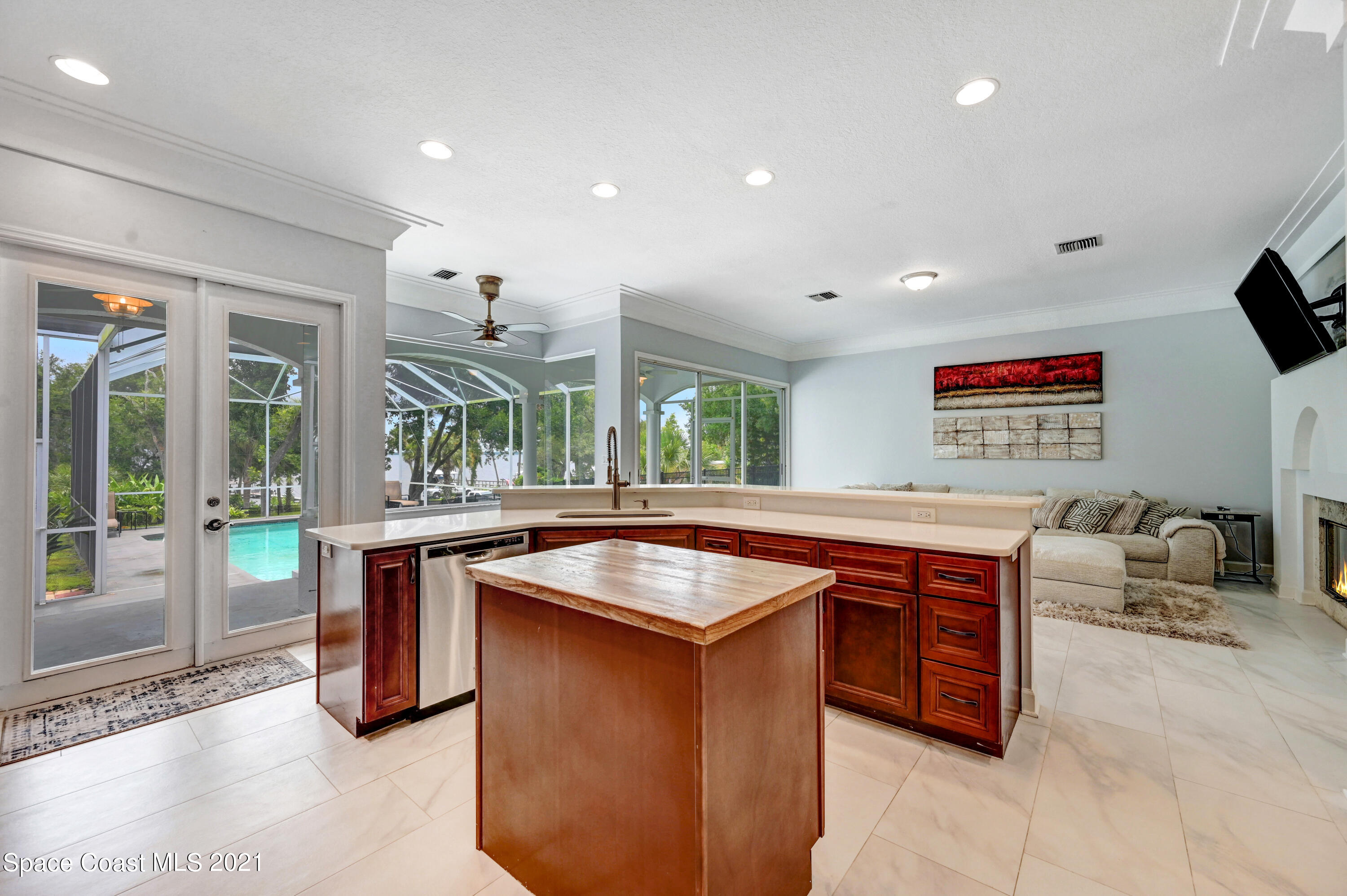 4601 Indian River Drive Cocoa, FL 32927 - Photo 15 of 51 a kitchen with stainless steel appliances granite countertop a stove a sink and a refrigerator