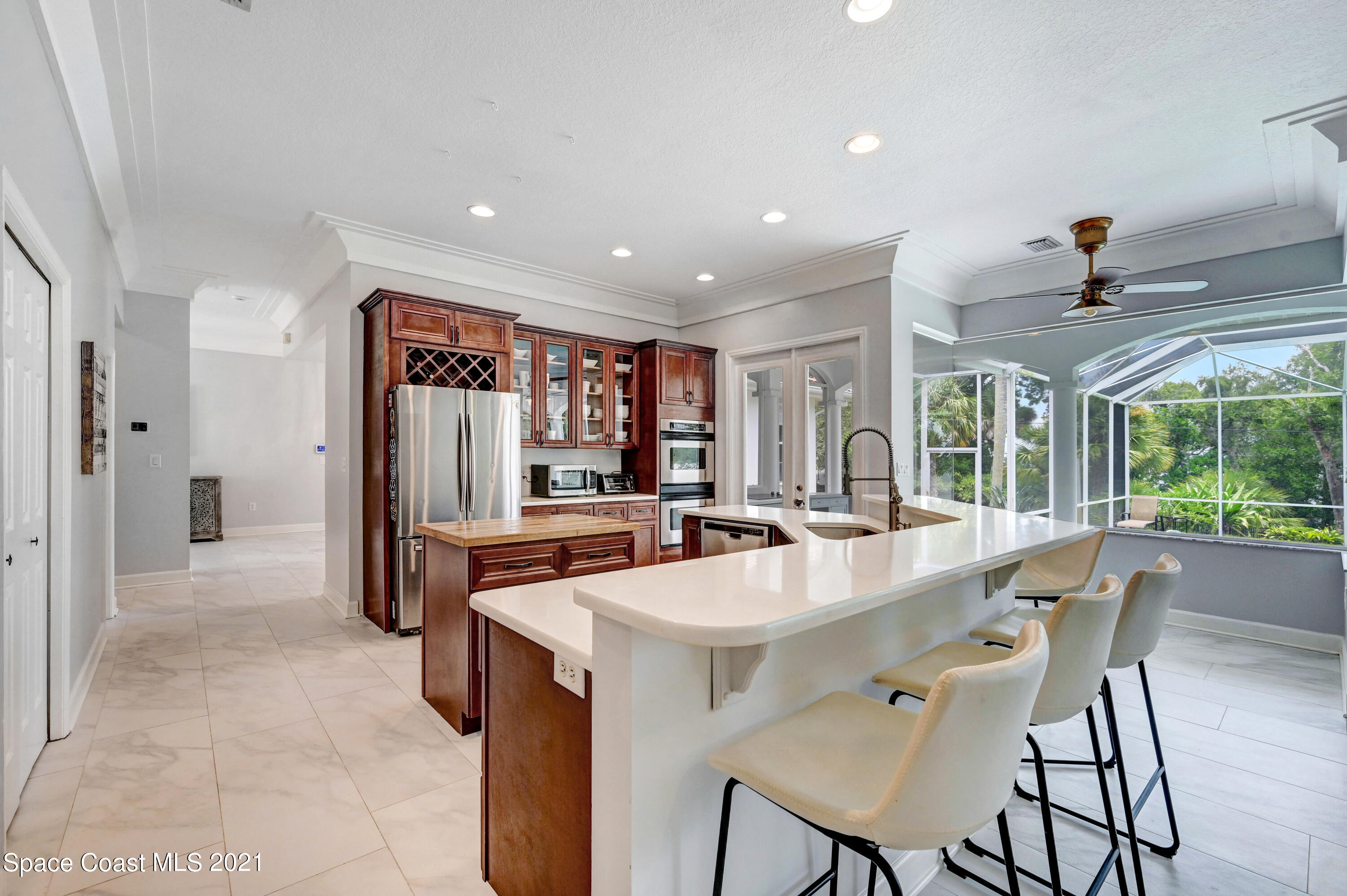 4601 Indian River Drive Cocoa, FL 32927 - Photo 16 of 51 a large kitchen with a table and chairs