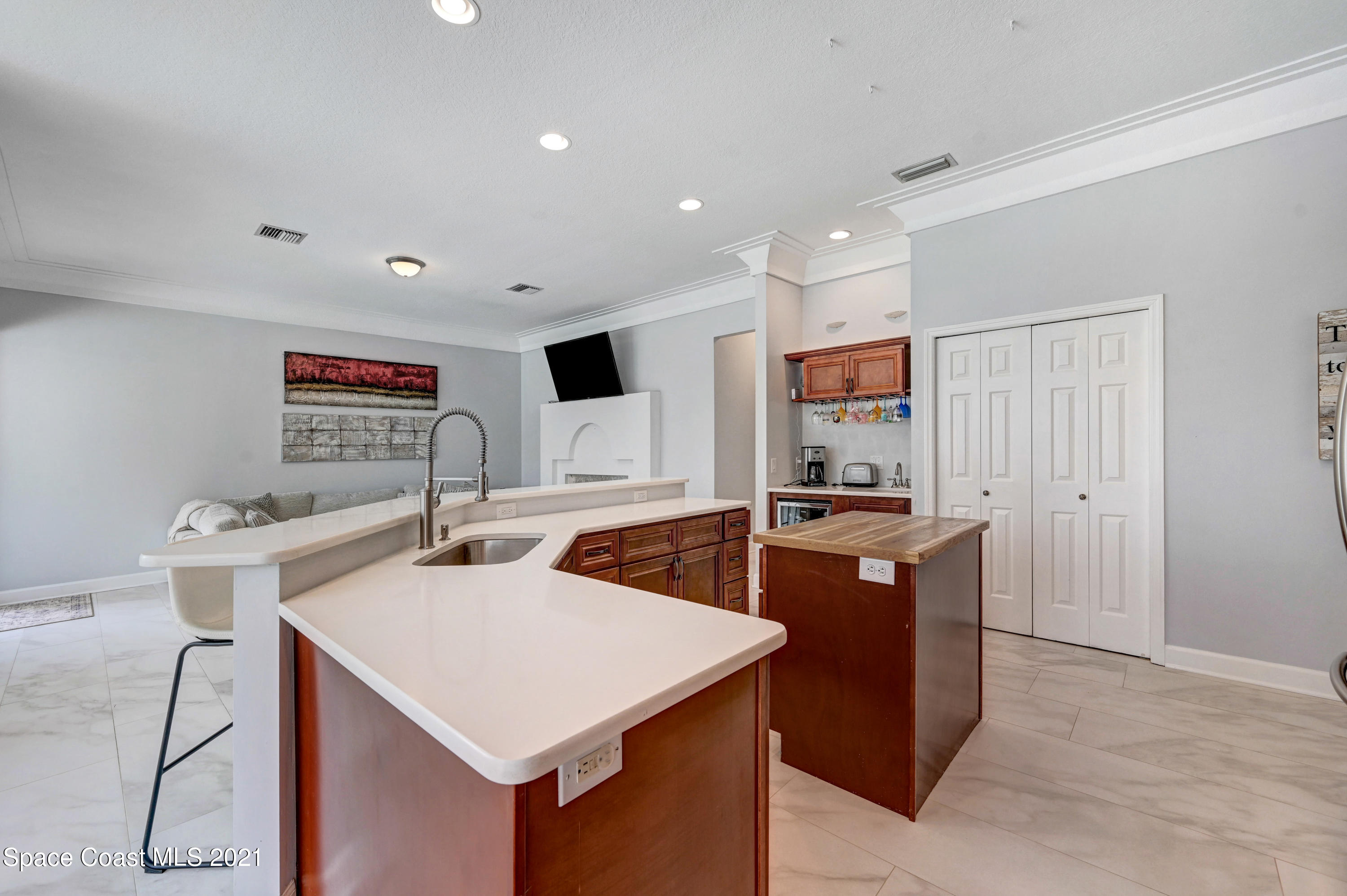 4601 Indian River Drive Cocoa, FL 32927 - Photo 18 of 51 a kitchen with stainless steel appliances granite countertop a stove a refrigerator a sink and a refrigerator