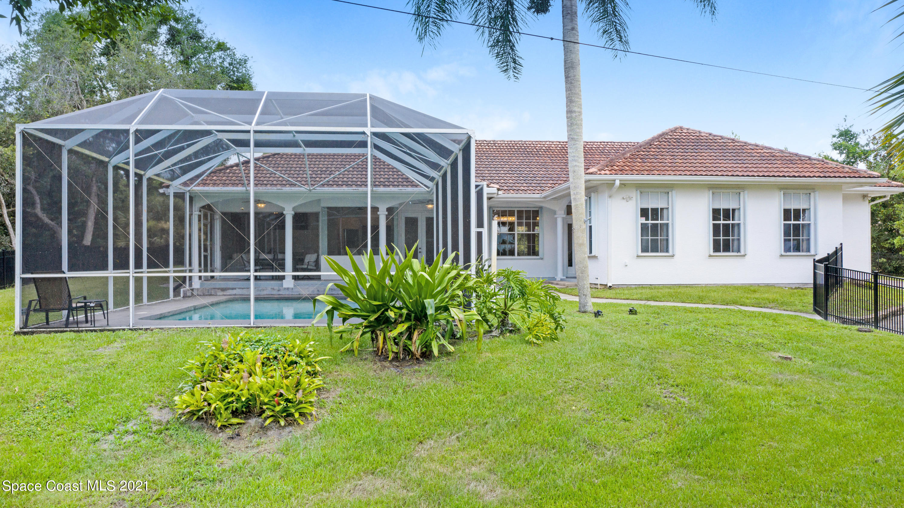 4601 Indian River Drive Cocoa, FL 32927 - Photo 3 of 51 a front view of a house with garden