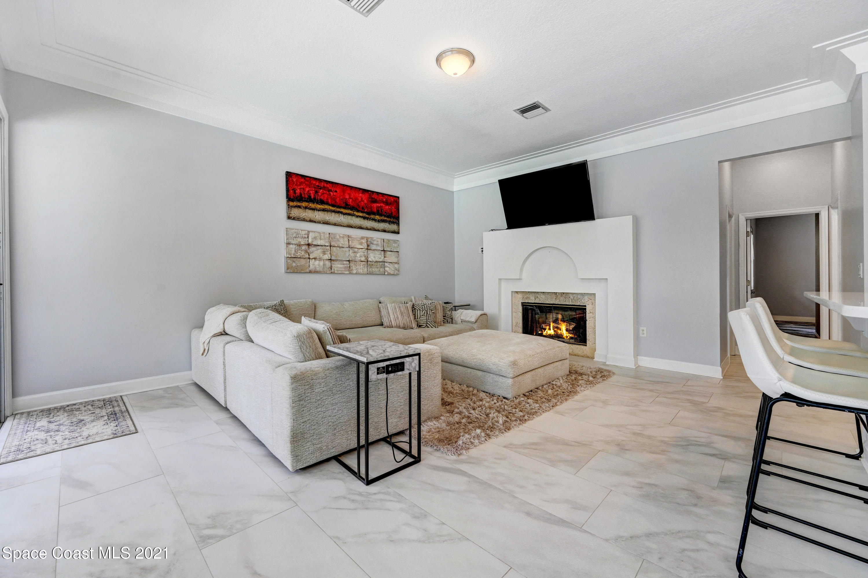 4601 Indian River Drive Cocoa, FL 32927 - Photo 22 of 51 a living room with furniture and a fireplace