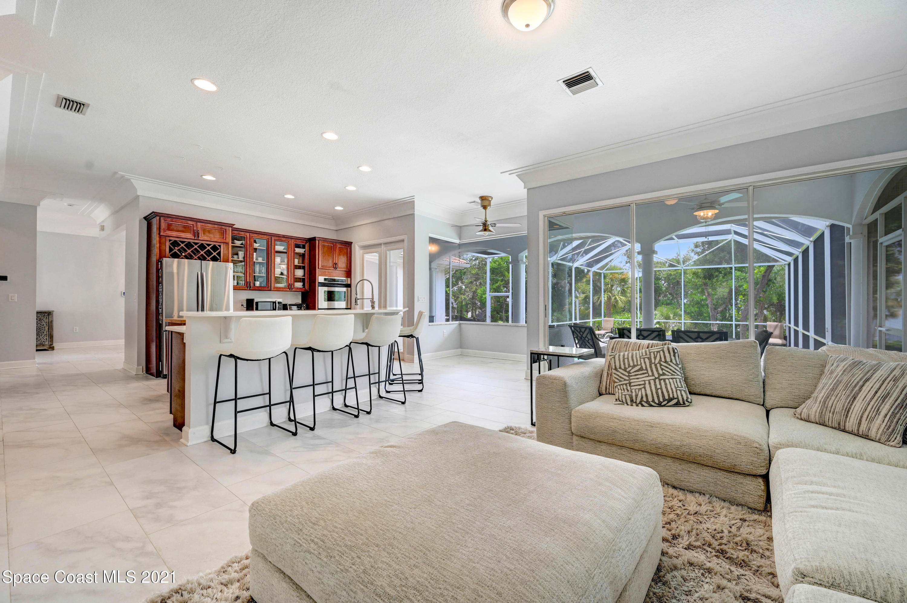 4601 Indian River Drive Cocoa, FL 32927 - Photo 24 of 51 a living room with furniture and a large window