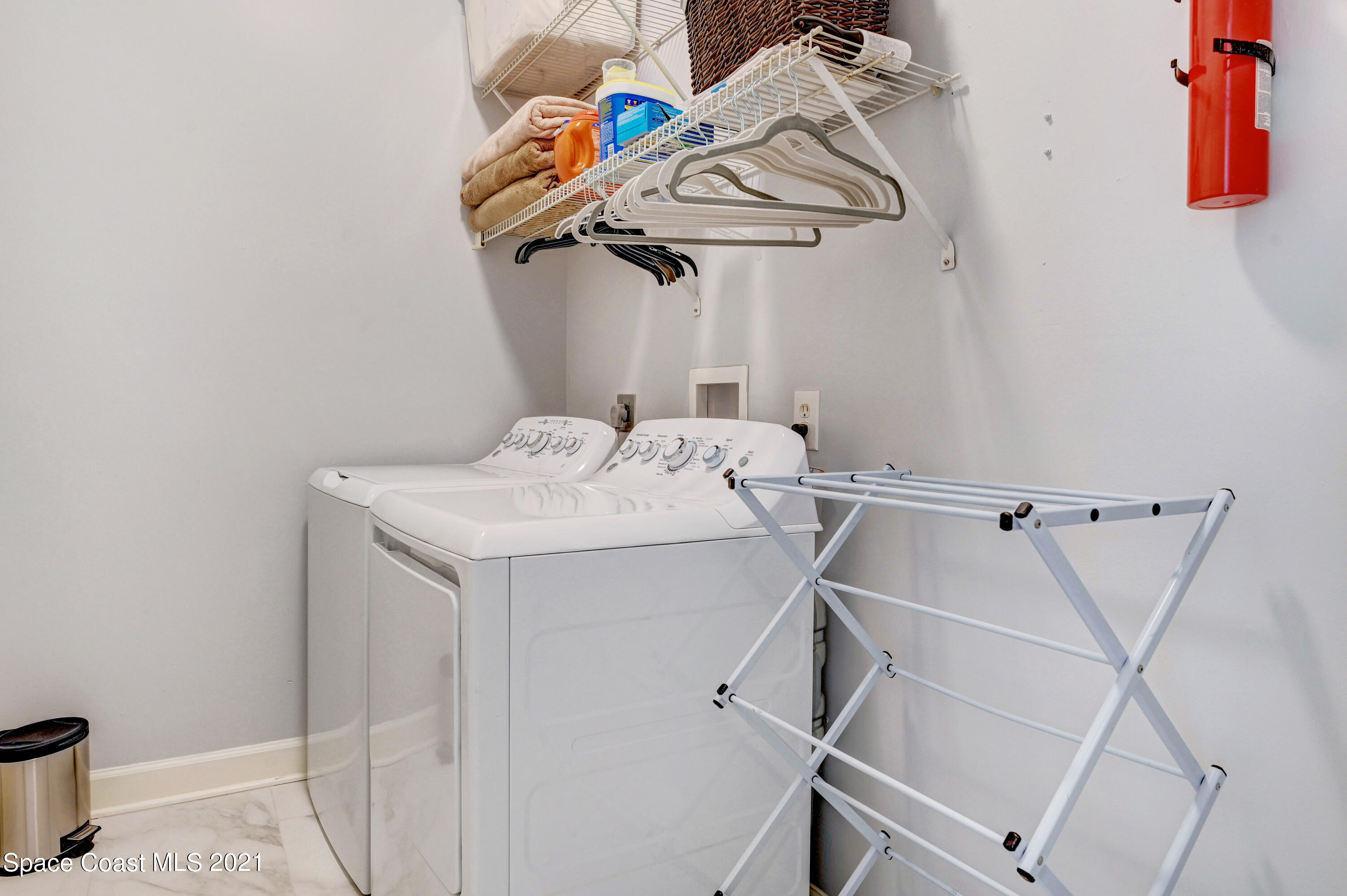 4601 Indian River Drive Cocoa, FL 32927 - Photo 30 of 51 a utility room with dryer and washer