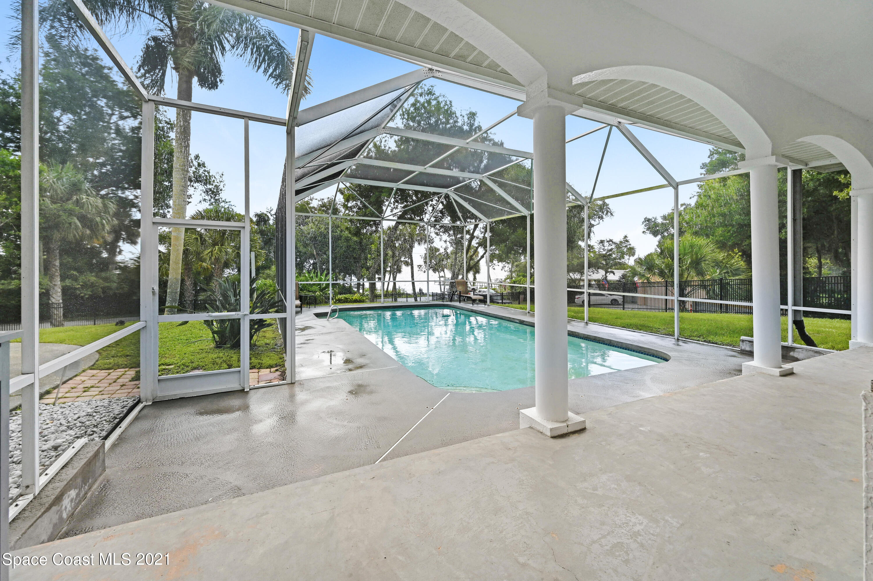 4601 Indian River Drive Cocoa, FL 32927 - Photo 43 of 51 a view of a house with a big yard and balcony