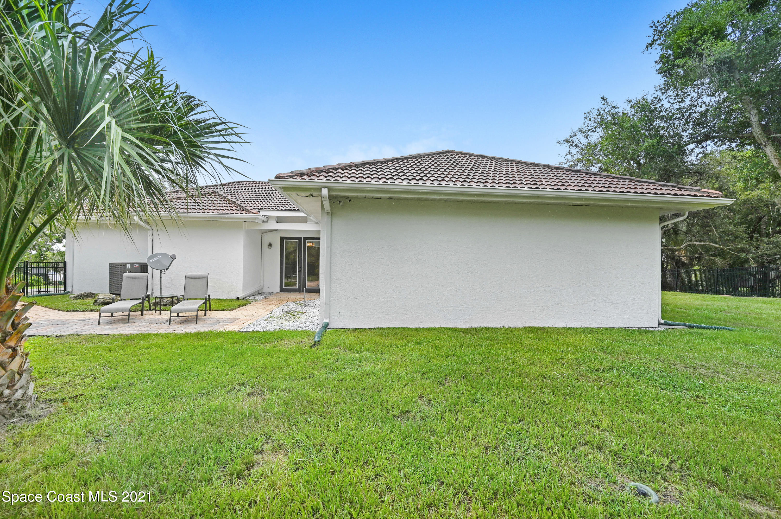 4601 Indian River Drive Cocoa, FL 32927 - Photo 44 of 51 a view of a house with a yard and sitting area