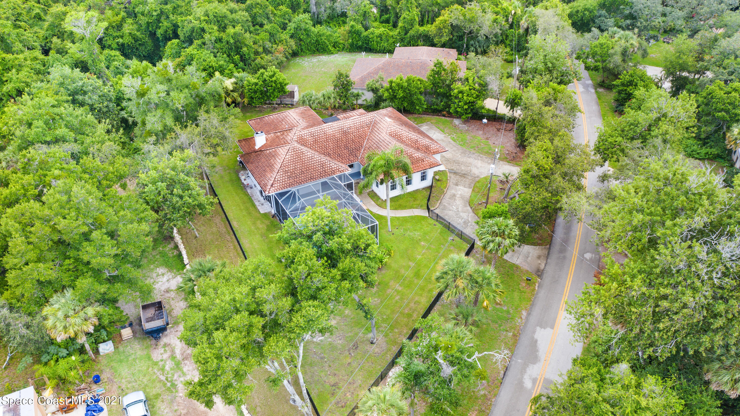 4601 Indian River Drive Cocoa, FL 32927 - Photo 48 of 51 an aerial view of residential house with outdoor space and trees all around