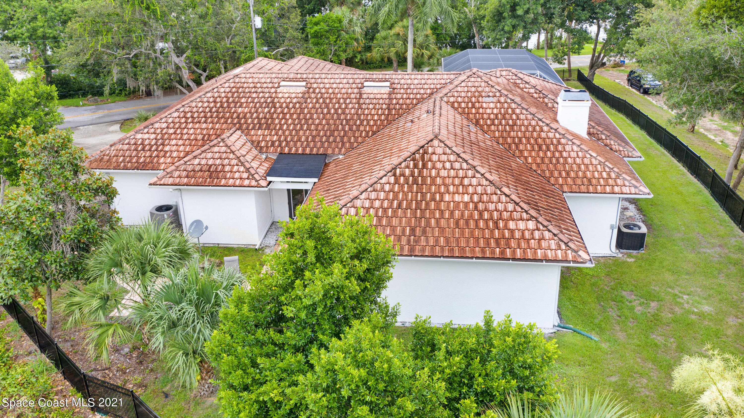 4601 Indian River Drive Cocoa, FL 32927 - Photo 50 of 51 a aerial view of a house with a garden and plants