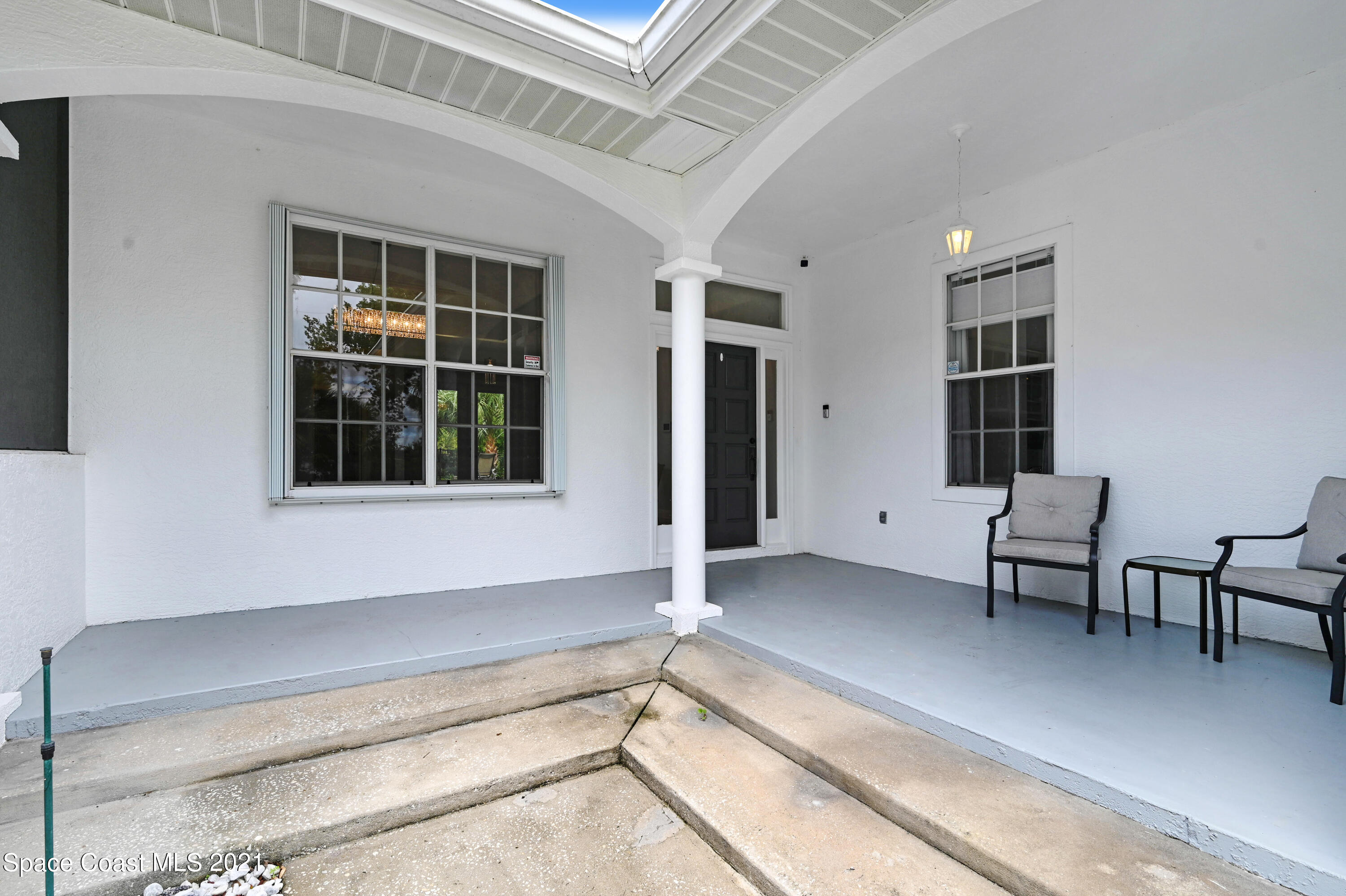 4601 Indian River Drive Cocoa, FL 32927 - Photo 10 of 51 a living room with a bed furniture and windows