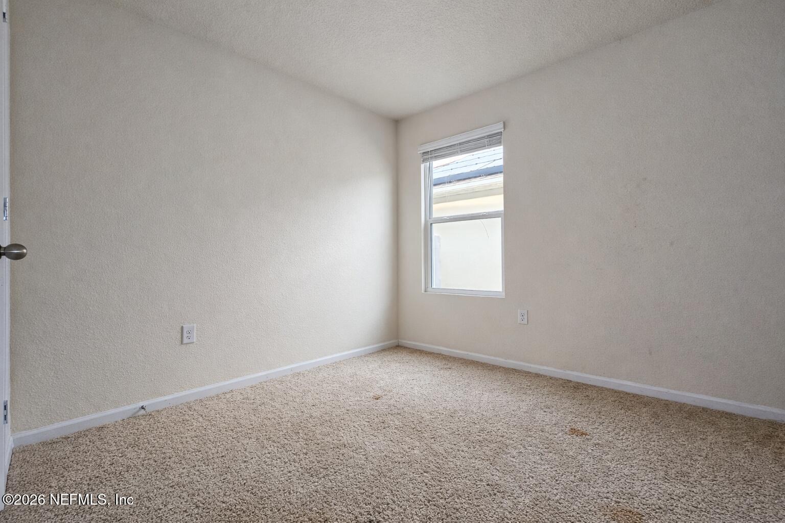 86226 Mainline Road Yulee, FL 32097 - Photo 13 of 22 an empty room with a window