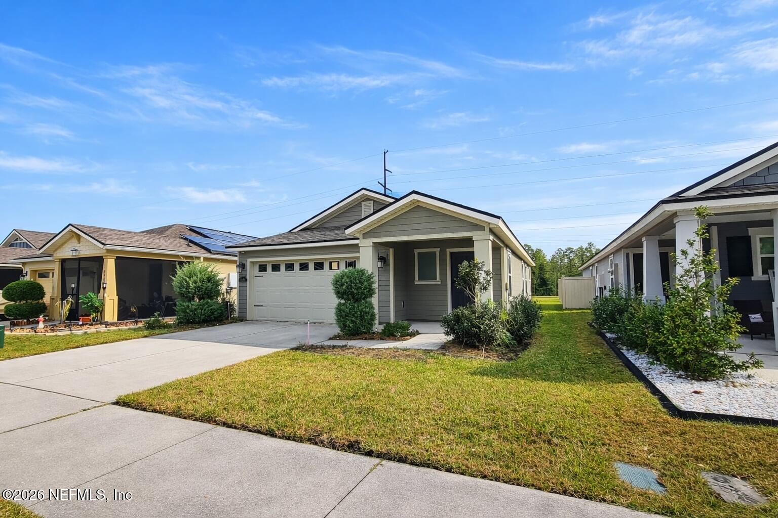 86226 Mainline Road Yulee, FL 32097 - Photo 16 of 22 a front view of a house with yard