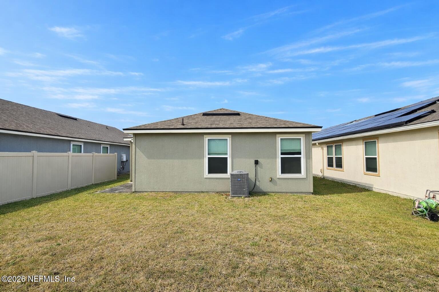 86226 Mainline Road Yulee, FL 32097 - Photo 17 of 22 front view of house with yard