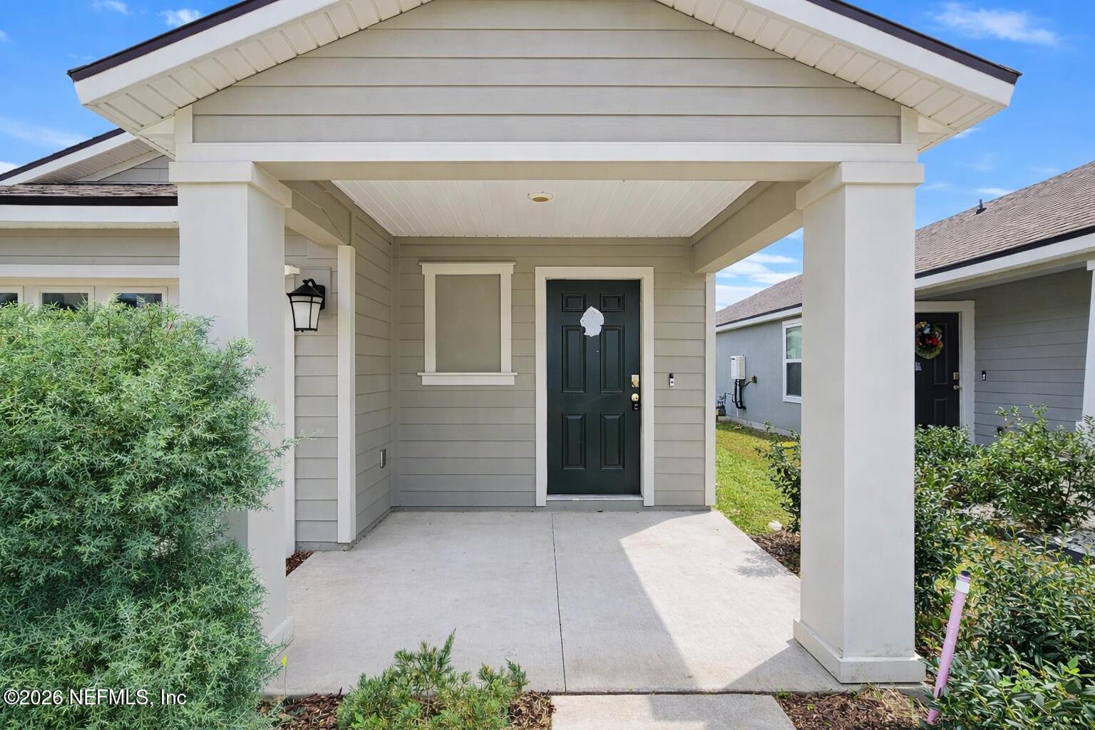 86226 Mainline Road Yulee, FL 32097 - Photo 19 of 22 a view of a entryway door front of house