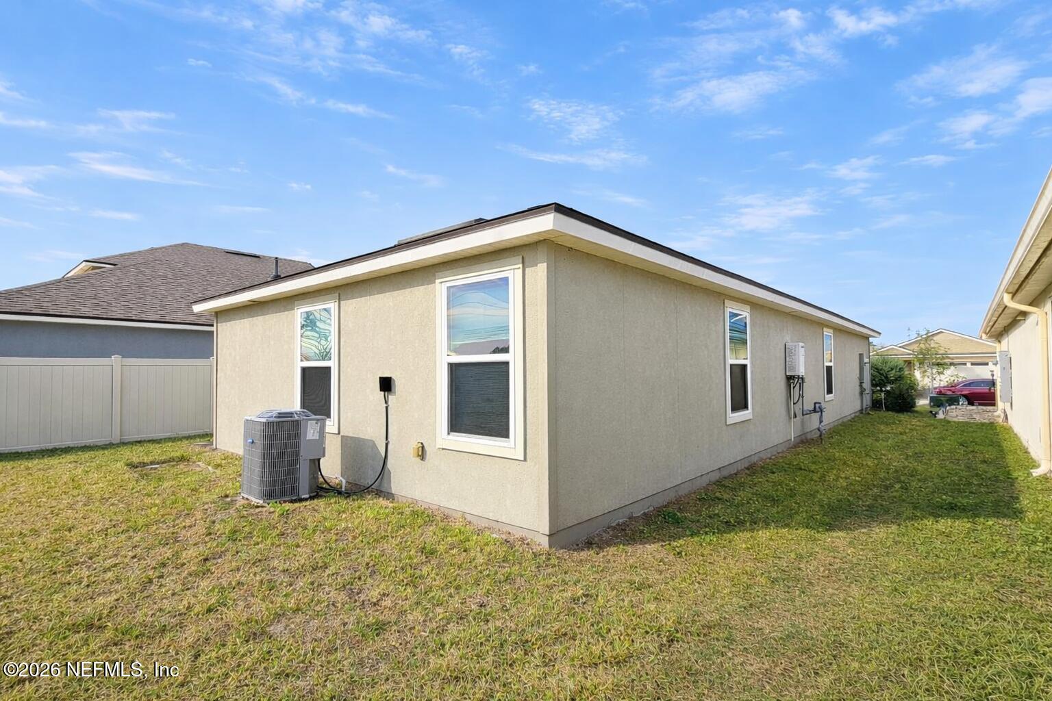 86226 Mainline Road Yulee, FL 32097 - Photo 21 of 22 a backyard of a house with seating space