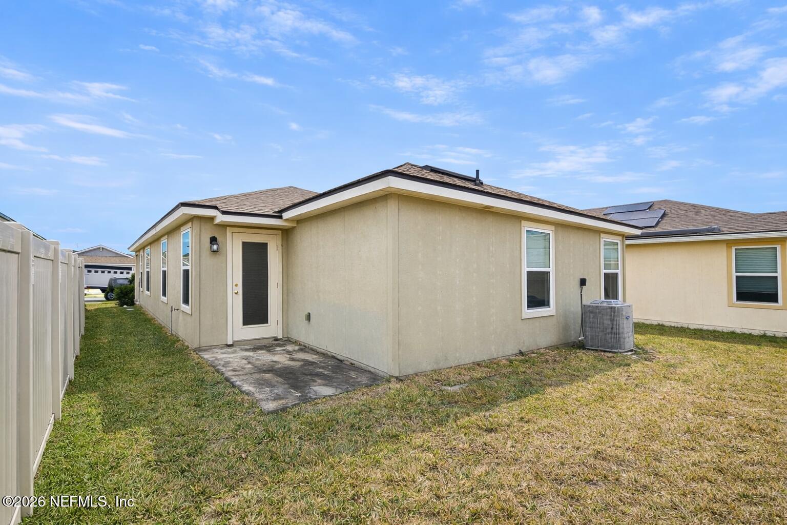 86226 Mainline Road Yulee, FL 32097 - Photo 22 of 22 a house with trees in front of it