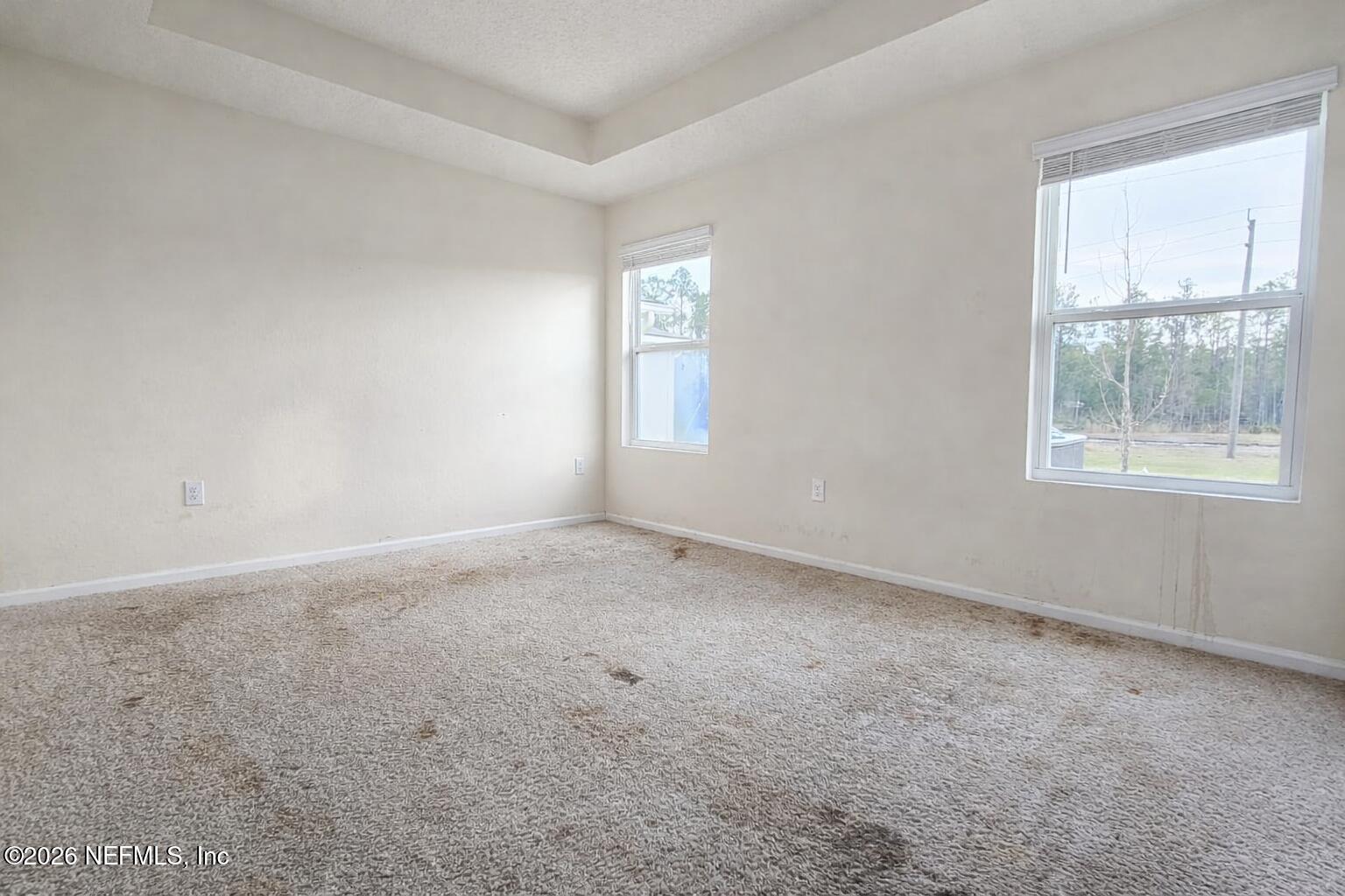 86226 Mainline Road Yulee, FL 32097 - Photo 4 of 22 an empty room with windows