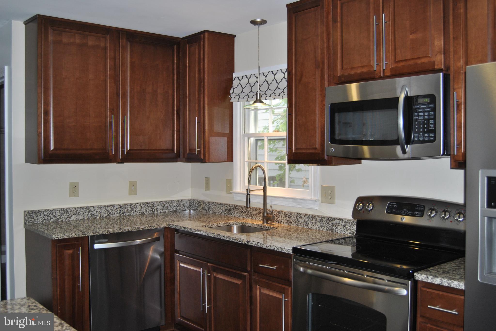 Cherry cabinets, granite, stainless appliances!