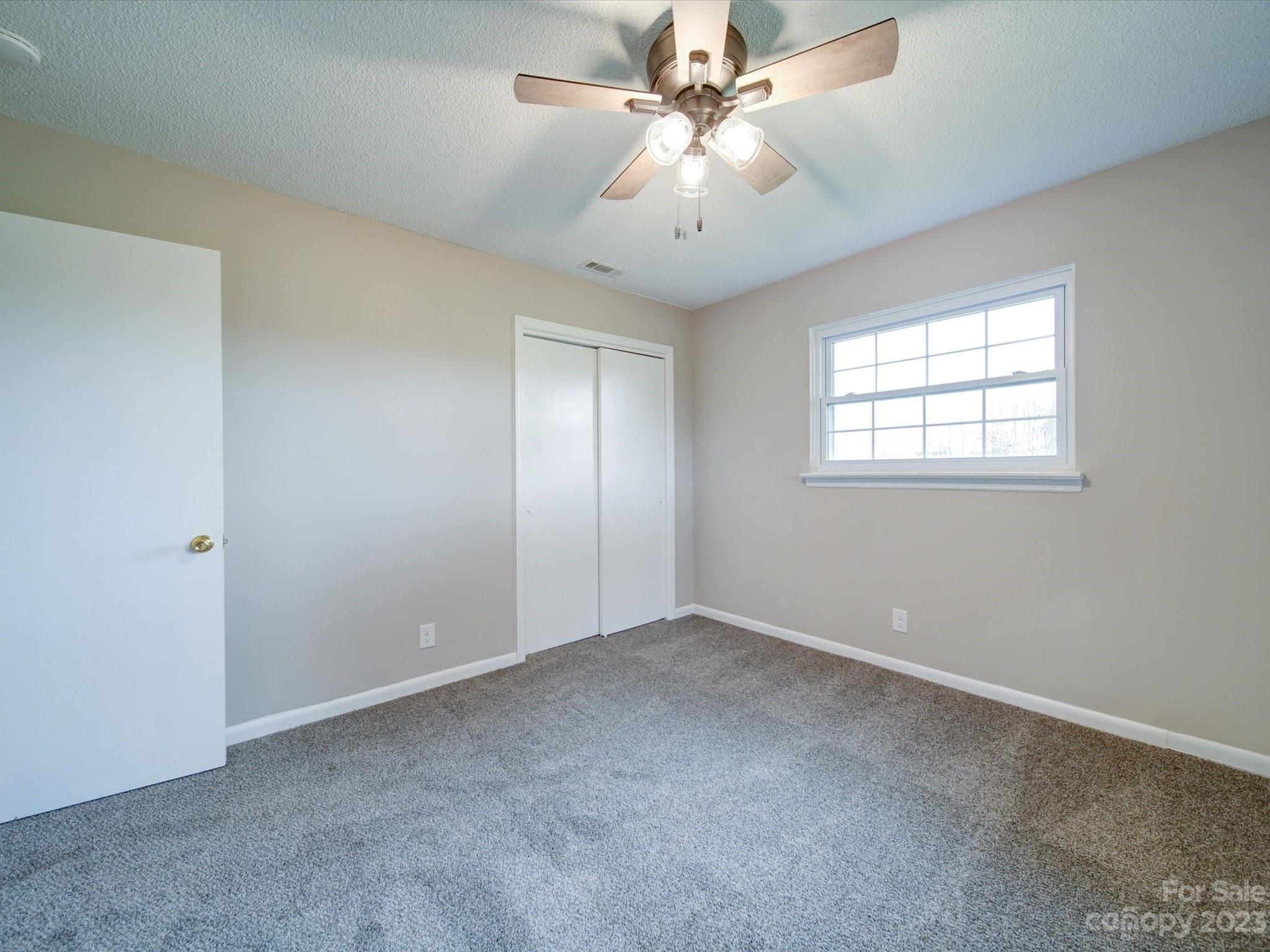893 State Rd S-13-35 Pageland, SC 29728 - Photo 24 of 25 an empty room with windows and fan