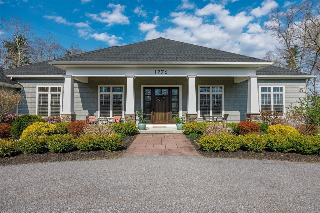 1776 Old Turnpike Road Oakham, MA 01068 - Photo 3 of 42 front view of a brick house with potted plants