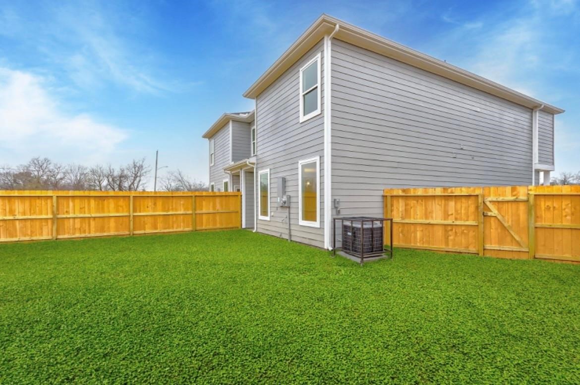 4806 Centipede Road, Unit A Houston, TX 77048 - Photo 18 of 19 a view of a house with a yard and a large tree