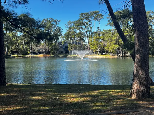 a view of a lake with a yard