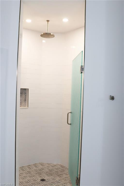 15489 Summit Pl Circle, Unit 302 Naples, FL 34119 - Photo 14 of 25 Rain showerhead in primary bathroom
