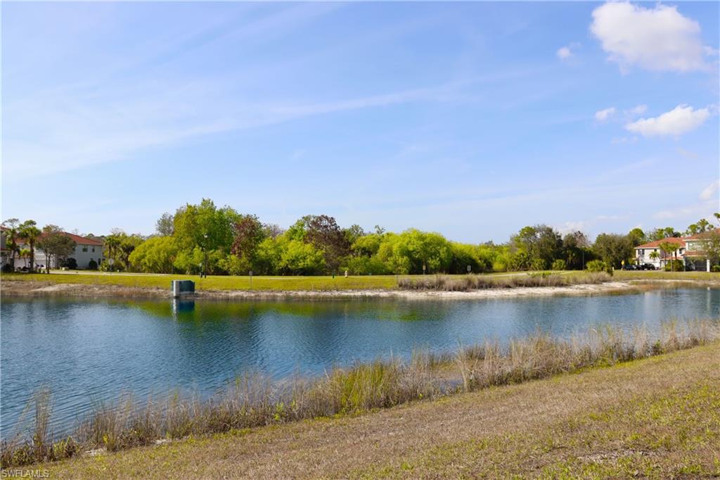 15489 Summit Pl Circle, Unit 302 Naples, FL 34119 - Photo 21 of 25 Western exposure with lake and preserve views