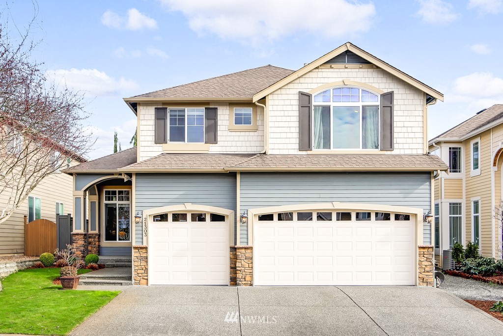 a front view of a house with a garage