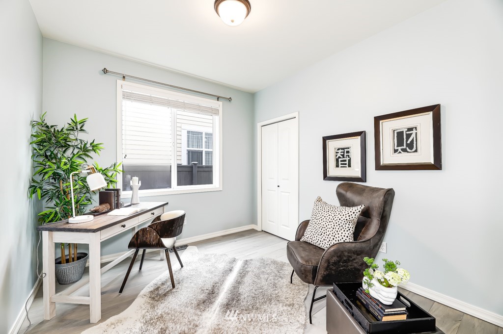 21303 37th Avenue Southeast Bothell, WA 98021 - Photo 11 of 34 a living room with furniture a potted plant and a window