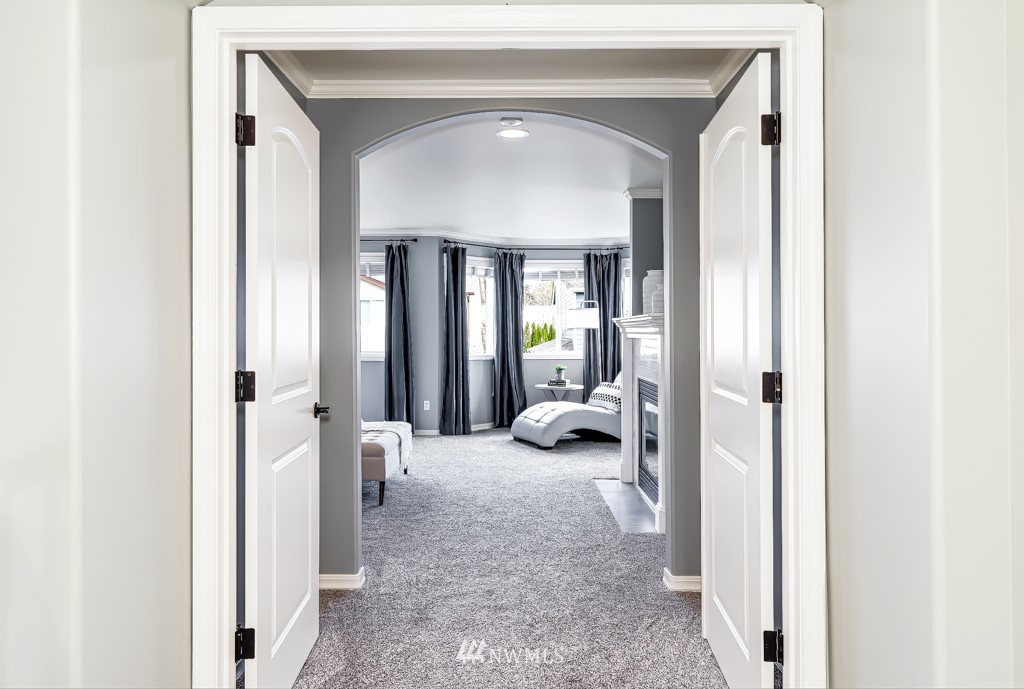 21303 37th Avenue Southeast Bothell, WA 98021 - Photo 14 of 34 a view of a hallway with living room and furniture