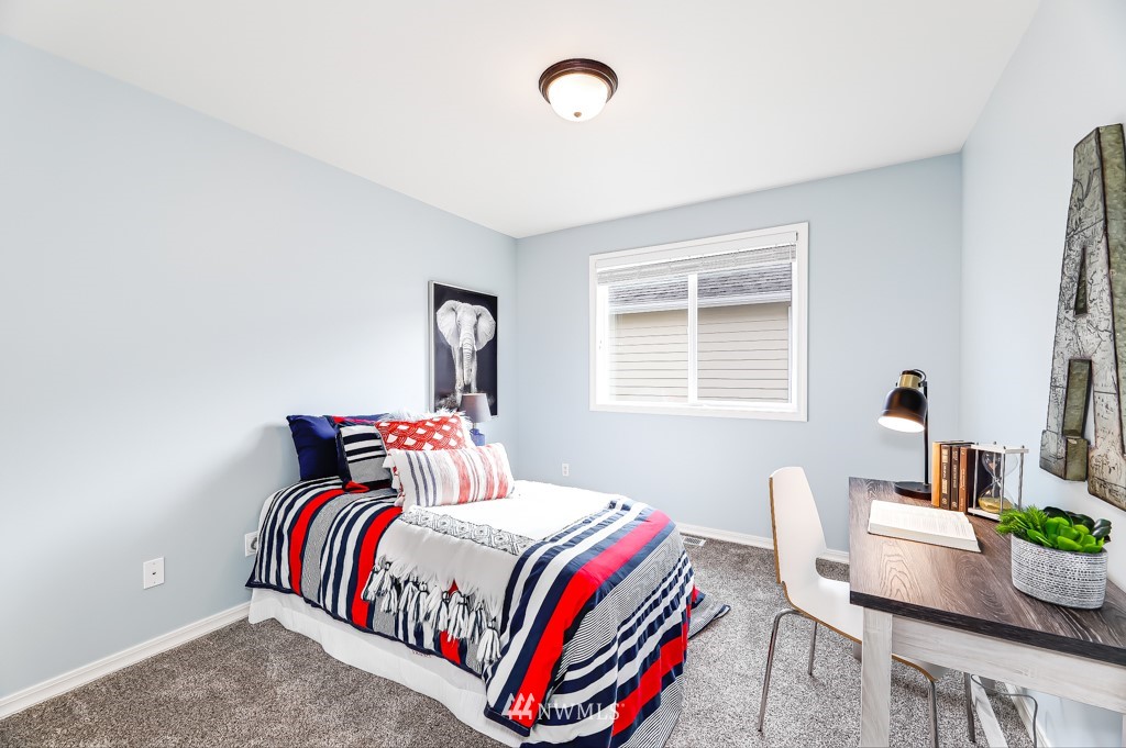 21303 37th Avenue Southeast Bothell, WA 98021 - Photo 21 of 34 a bedroom with a bed and a window