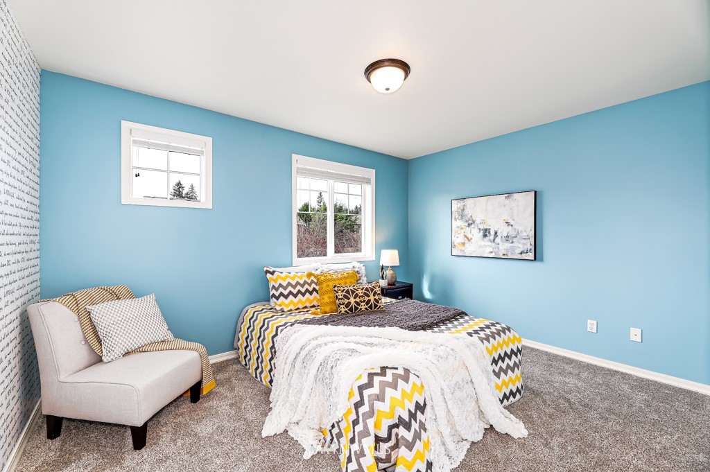 21303 37th Avenue Southeast Bothell, WA 98021 - Photo 22 of 34 a bedroom with a bed and a couch