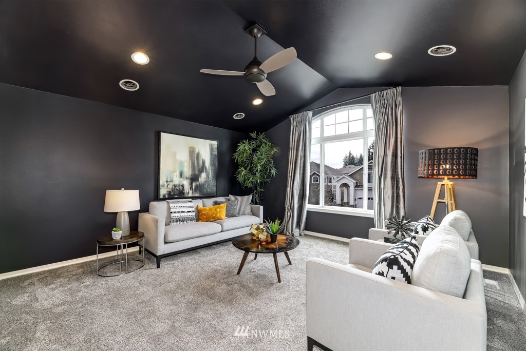 21303 37th Avenue Southeast Bothell, WA 98021 - Photo 23 of 34 a living room with furniture and a large window
